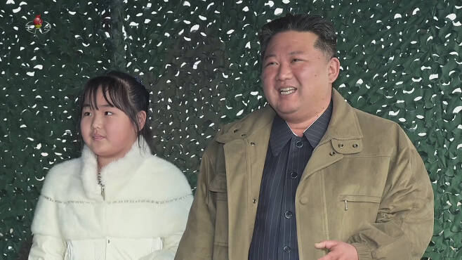 This file photo released by the Korean Central News Agency shows North Korean leader Kim Jong-un (right) and his daughter Kim Ju-ae. (KCNA-Yonhap)