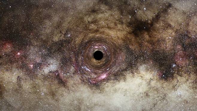 영국 더럼대학 물리학과 연구팀이 발견한 태양 질량의 300억 배가 넘는 초대질량 블랙홀 상상도. /ESA/Hubble, Digitized Sky Survey, Nick Risinger, N. Bartmann