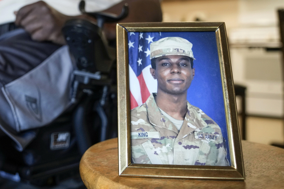 A portrait of American soldier Travis King is displayed as his grandfather, Carl Gates, talks about his grandson on July 19 in Kenosha, Wisconsin. [AP]