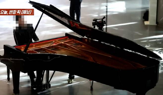 여성 마사지사 성매매 혐의로 고발 당한 피아니스트 A씨.(사진=JTBC ‘사건반장’ 캡처)