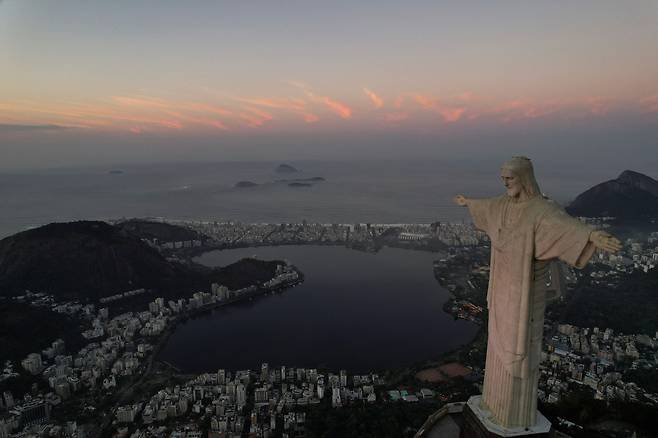 A drone view shows the statue of Christ the Redeemer during sunrise in Rio de Janeiro, Brazil, May 17, 2024. REUTERS/Ricardo Moraes