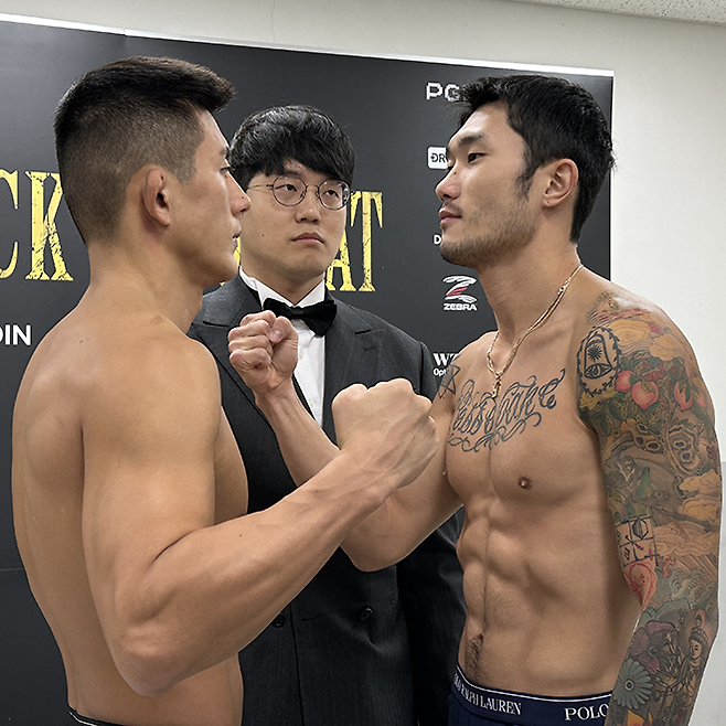 PFL 및 원챔피언십 출신 이도겸(왼쪽)이 블랙컴뱃 13 라이트급 계체 통과 후 황도윤(오른쪽)과 마주 보고 있다. 사진=이데아 파라곤