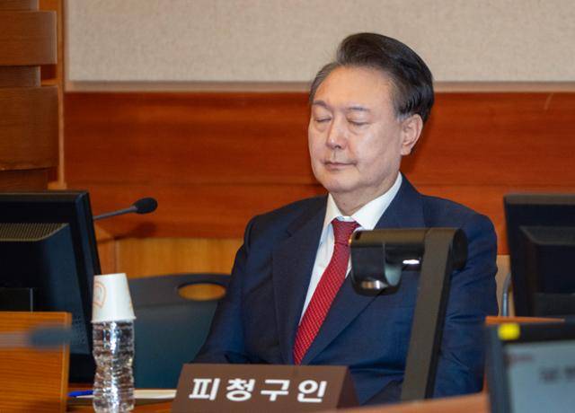 윤석열 대통령이 20일 서울 종로구 헌법재판소 대심판정에서 열린 윤 대통령의 탄핵 심판 10차 변론에 출석해 있다. 사진공동취재단