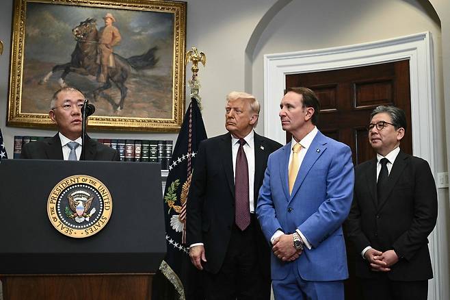Left to right): Hyundai Motor Group Executive Chairman Chung Euisun speaks as US President Donald Trump, Louisiana Gov. Jeff Landry and Hyundai Motor Company CEO Jaehoon Chang look on in the Roosevelt Room of the White House in Washington, on Monday. (AFP)