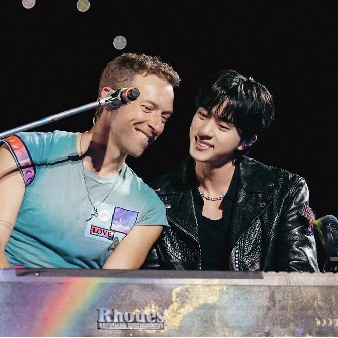 Chris Matin (left) of Coldplay and Jin of BTS sing "The Astronaut" at the third show of the British band's "Music of the Spheres" concert in Korea, at Goyang Sports Complex Stadium in Gyeonggi Province, Saturday. (Jin's Instagram)