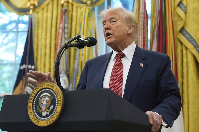 US President Donald Trump speaks after David Perdue was sworn in as US ambassador to China at the Oval Office of the White House, in Washington, Wednesday. (AP-Yonhap)