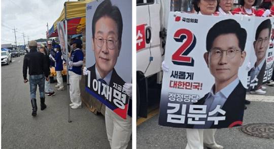 16일 오전 천안 병천면 병천시장에 이재명 더불어민주당 대선 후보(왼쪽)와 김문수 국민의힘 대선 후보(오른쪽)의 유세차량 길가에 서서 지지를 호소하고 있다. 박하늘 기자