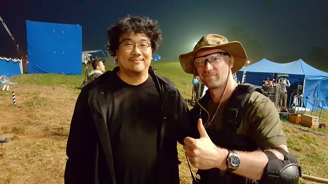 Director Bong Joon-ho (left) and Andreas Fronk on the set of "Okja" (Courtesy of Fronk)