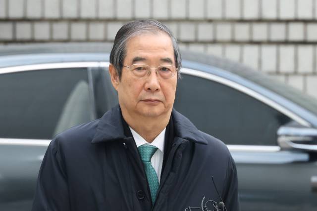 내란 우두머리 방조 혐의를 받는 한덕수 전 국무총리가 26일 서울중앙지법에서 열린 1심 결심 공판에 출석하고 있다. 연합뉴스