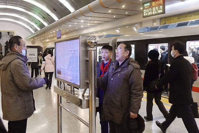 People read a copy of North Korea's official newspaper, Rodong Sinmun, on display at a subway station in Pyongyang on Jan. 22, 2025. (Kyodo News via Getty Images)