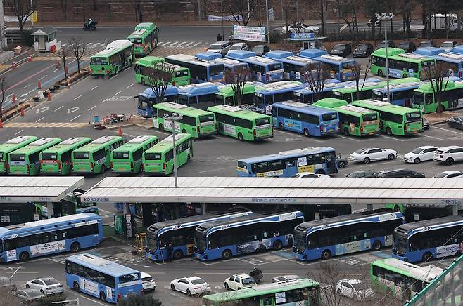 City buses are parked at a public bus garage in Seoul on Monday. (Yonhap)