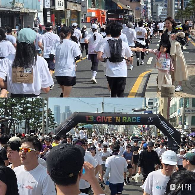 부산 광안리 해수욕장에 마련된 '기브앤 레이스' 피니시라인에 참가자들이 모여들고 있다. /사진=최유빈 기자