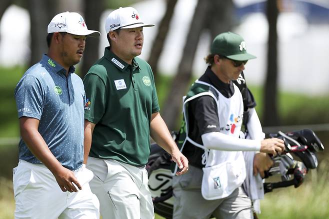 MCKINNEY, TEXAS - MAY 23: Si Woo Kim of South Korea and Sungjae Im of South Korea walk the second hole during the third round of THE CJ CUP Byron Nelson 2026 at TPC Craig Ranch on May 23, 2026 in McKinney, Texas. (Photo by Mike Mulholland/Getty Images for The CJ Cup)