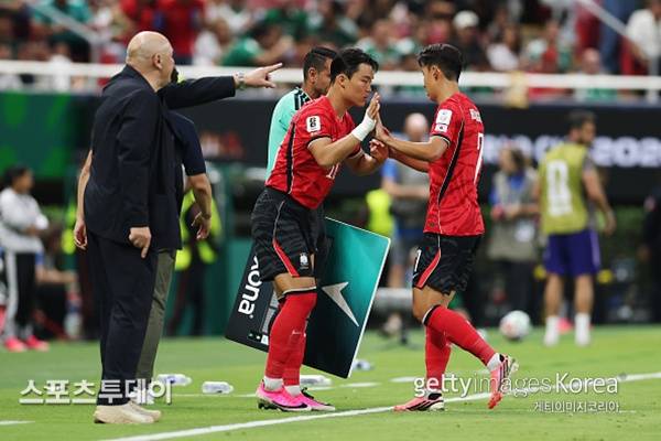 오현규와 손흥민 / 사진=Gettyimages 제공