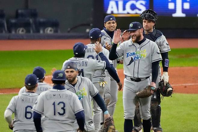 APTOPIX ALCS Rays Guardians BaseballTampa Bay Rays pitcher Bryan Baker celebrates their win against the Cleveland Guardians in Game 4 of an American League Championship Series baseball game in Cleveland, Saturday, Oct. 17, 2026. (AP Photo/Sue Ogrocki)